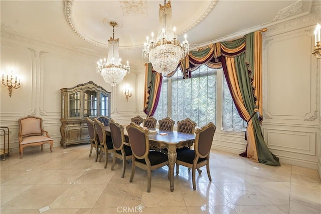 dining room with marble finish floor, a decorative wall, ornamental molding, and an inviting chandelier