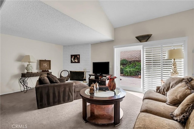 carpeted living room with lofted ceiling, a fireplace, and a textured ceiling