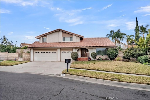 view of front of house featuring a garage and a front yard