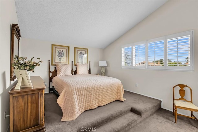 bedroom featuring vaulted ceiling, carpet, and a textured ceiling