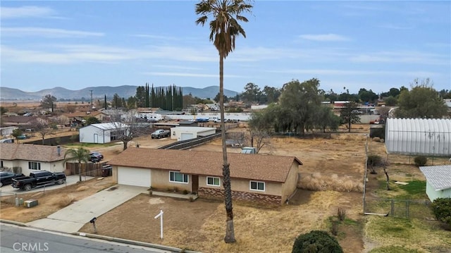 birds eye view of property with a mountain view