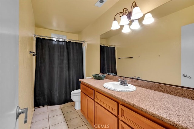 bathroom featuring tile patterned floors, toilet, and vanity