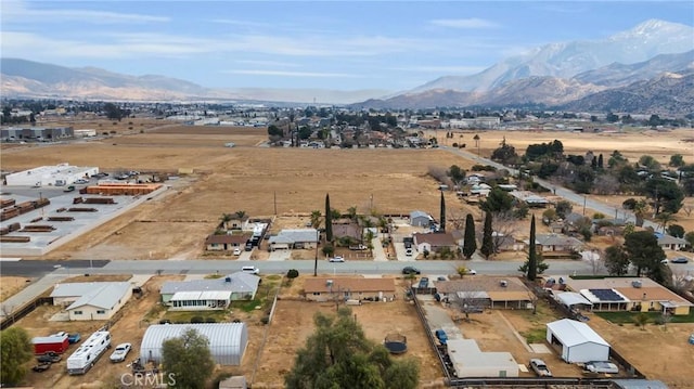 birds eye view of property featuring a mountain view