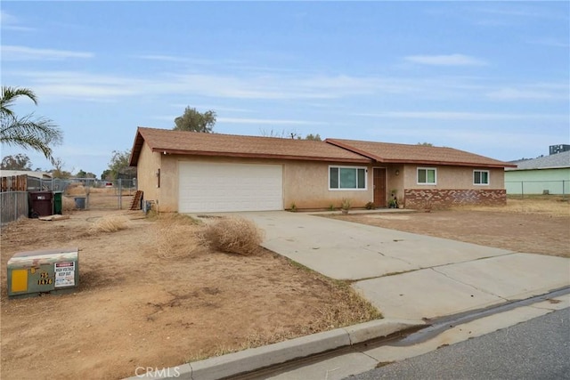 ranch-style home featuring a garage