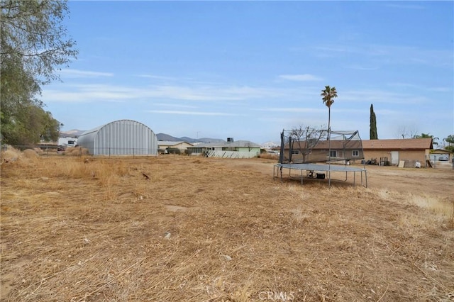 view of yard featuring a trampoline