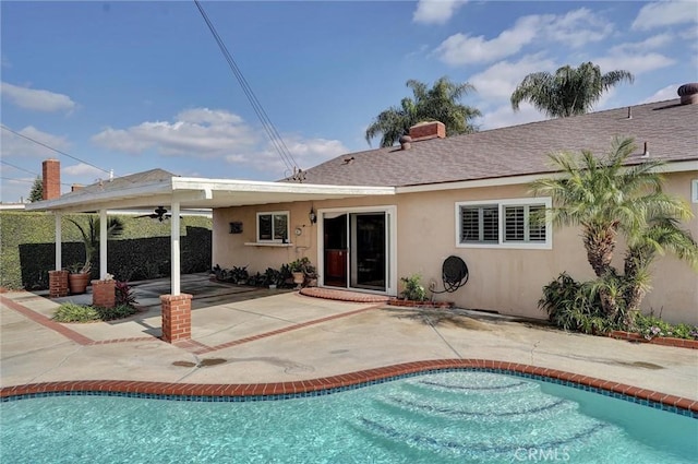 back of property featuring a patio