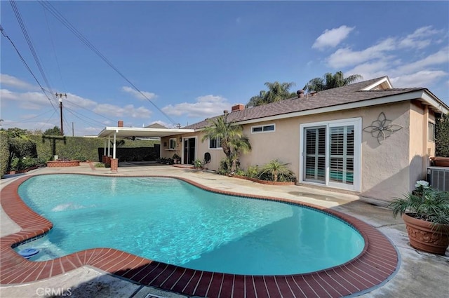 view of swimming pool featuring a patio area