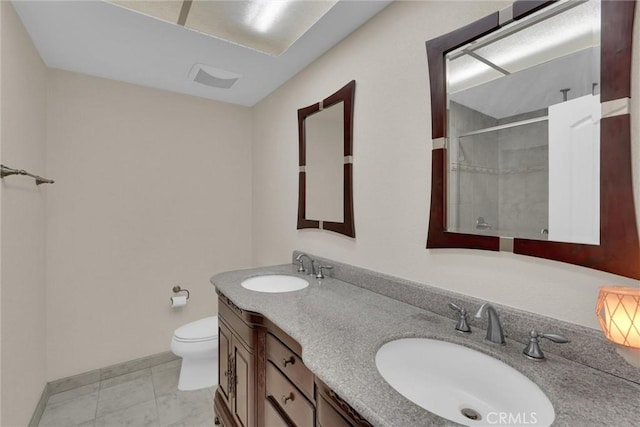 bathroom with tile patterned flooring, vanity, walk in shower, and toilet