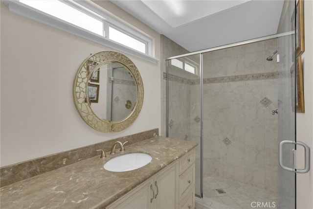 bathroom with vanity and an enclosed shower