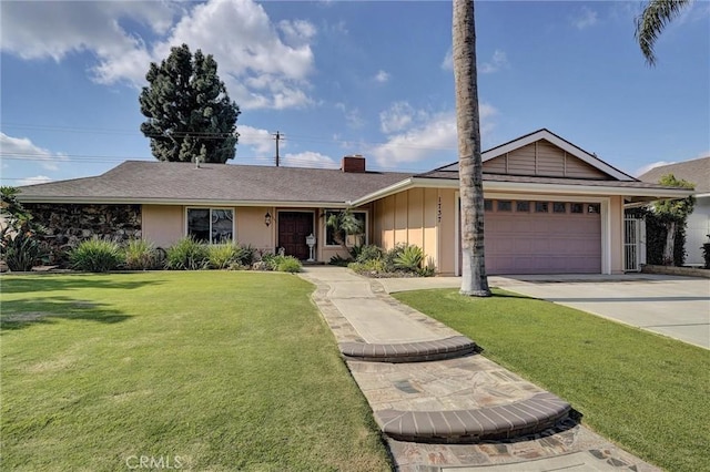 ranch-style home featuring a garage and a front lawn