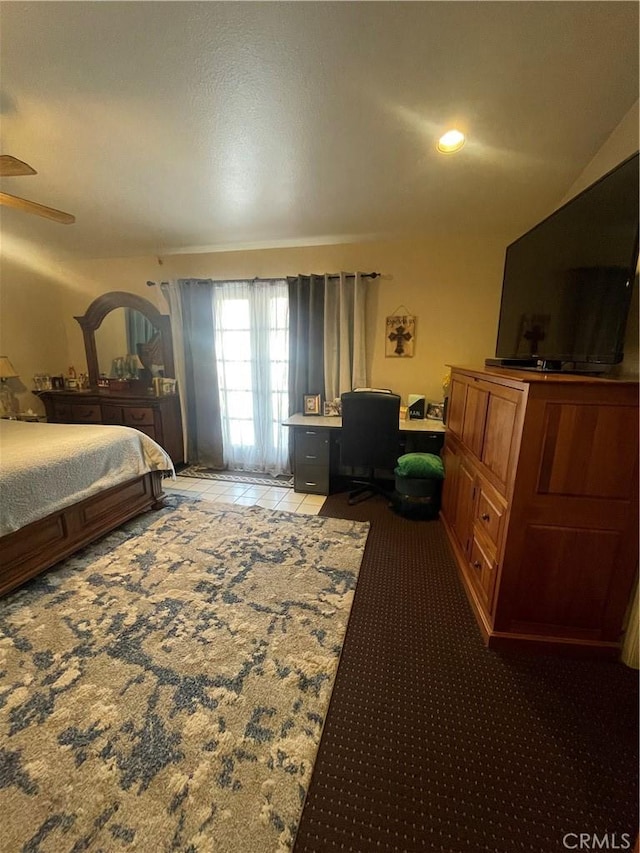 bedroom with ceiling fan and light colored carpet