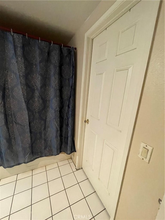 bathroom with tile patterned flooring