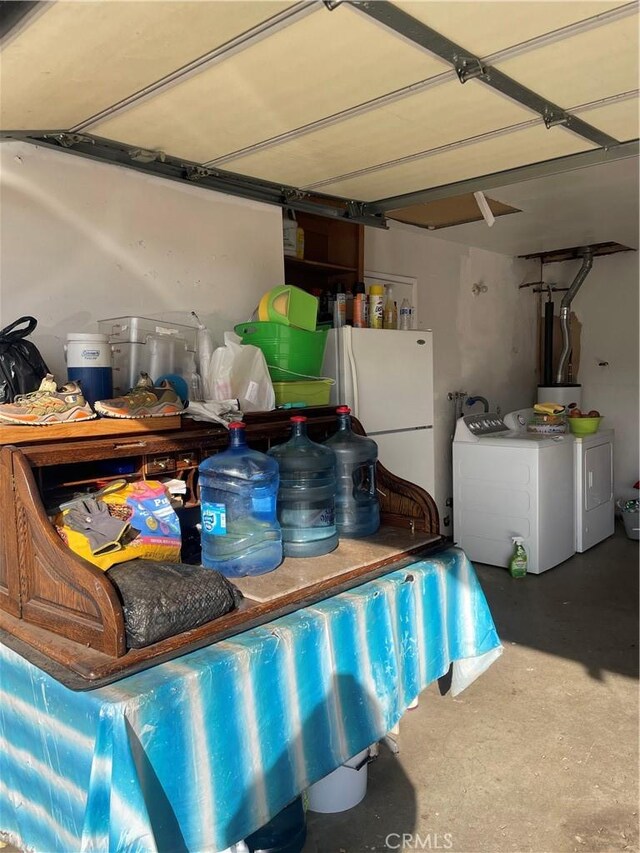 garage featuring washer and dryer