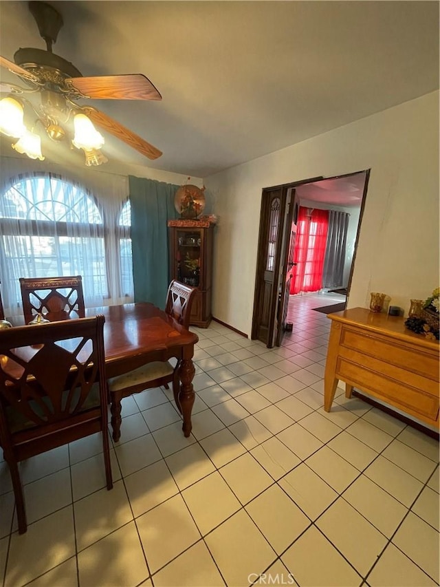 dining room featuring ceiling fan and light tile patterned flooring