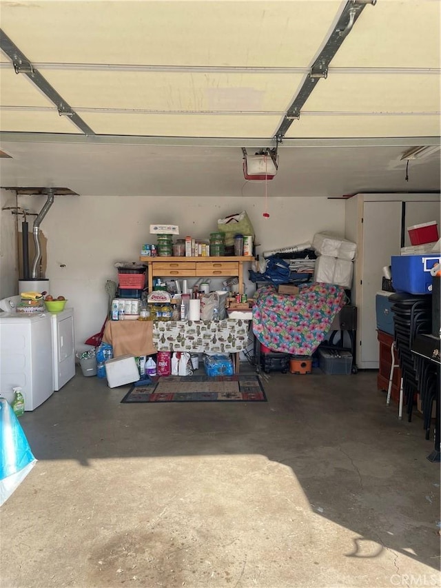 garage featuring a garage door opener and washing machine and dryer