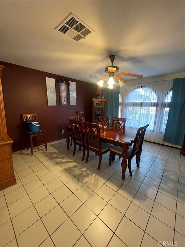 dining room with ceiling fan and light tile patterned floors