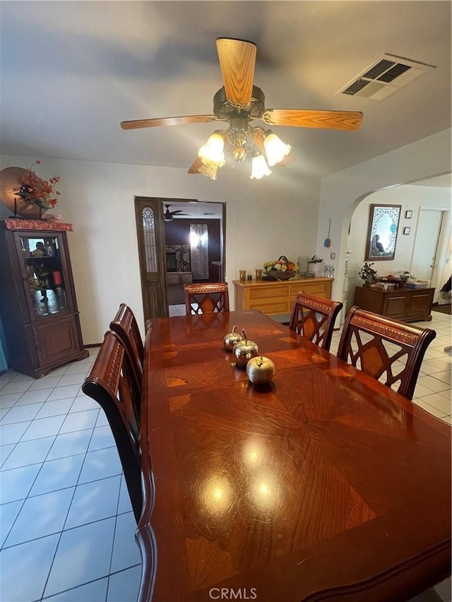 dining space with ceiling fan and light tile patterned floors