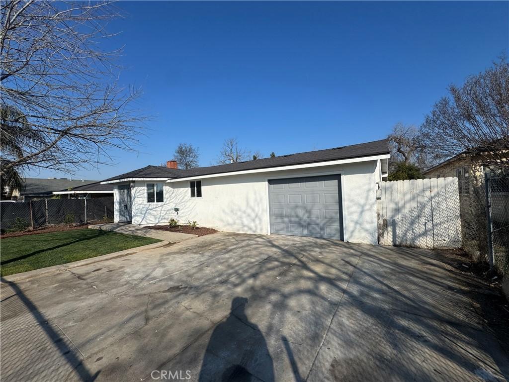 rear view of property featuring a garage