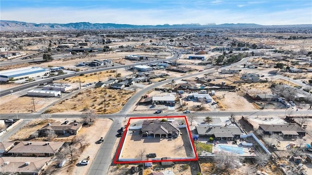 birds eye view of property with a mountain view