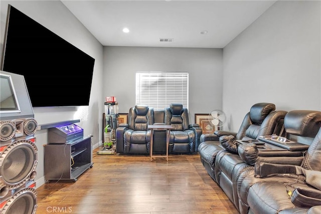 home theater with light hardwood / wood-style flooring