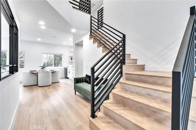 stairway featuring hardwood / wood-style floors