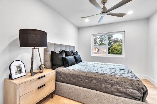 bedroom featuring ceiling fan and light wood-type flooring