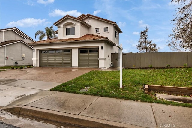 view of front facade with a garage and a front yard