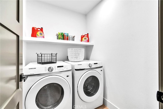 washroom featuring washer and clothes dryer