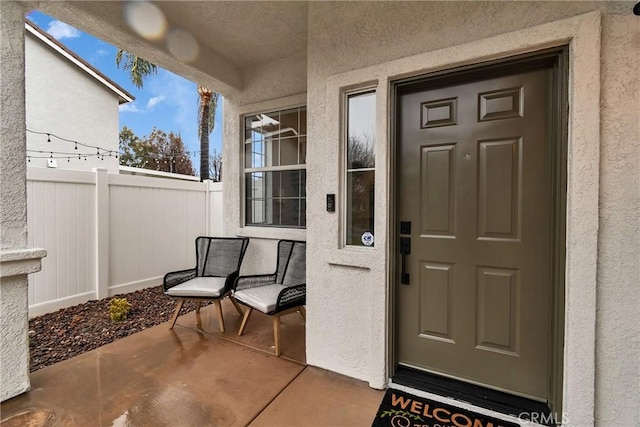 property entrance with a patio