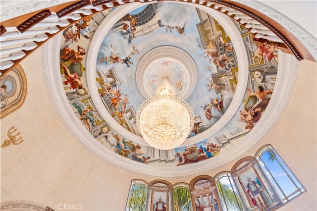 interior details featuring a notable chandelier