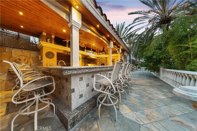 patio terrace at dusk with exterior bar