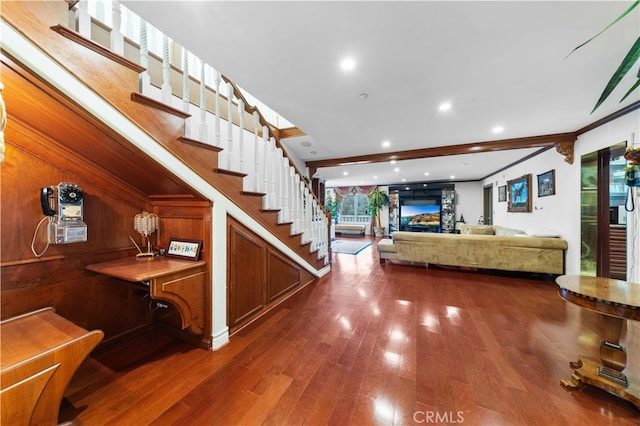 stairs featuring hardwood / wood-style floors