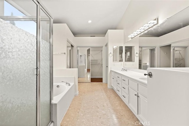 bathroom featuring vanity, separate shower and tub, and tile patterned flooring