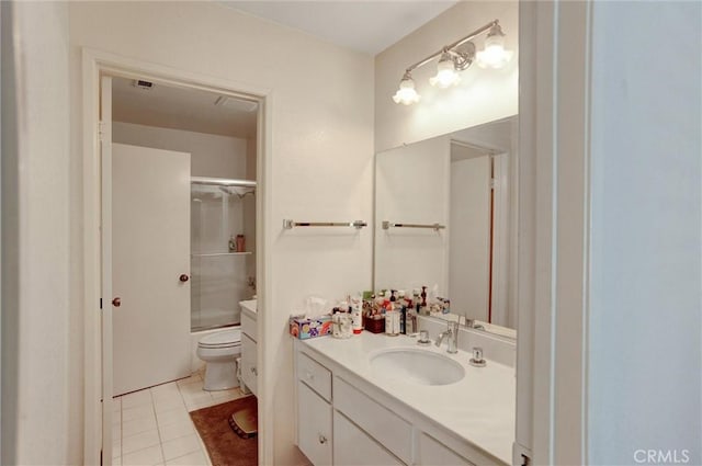 full bathroom featuring vanity, tile patterned floors, enclosed tub / shower combo, and toilet