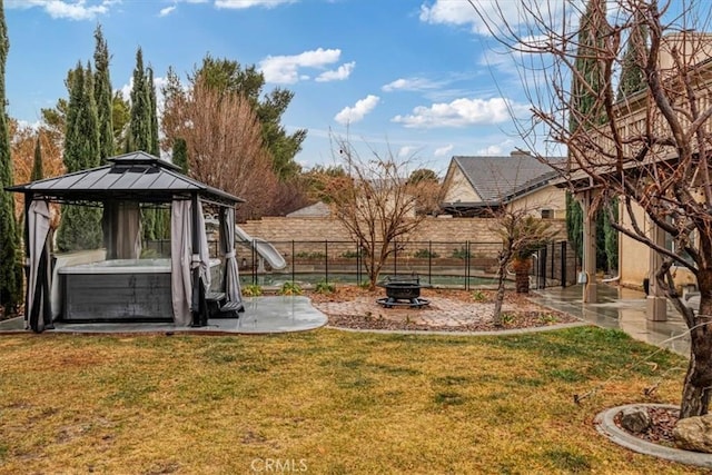 view of yard featuring a fire pit and a gazebo