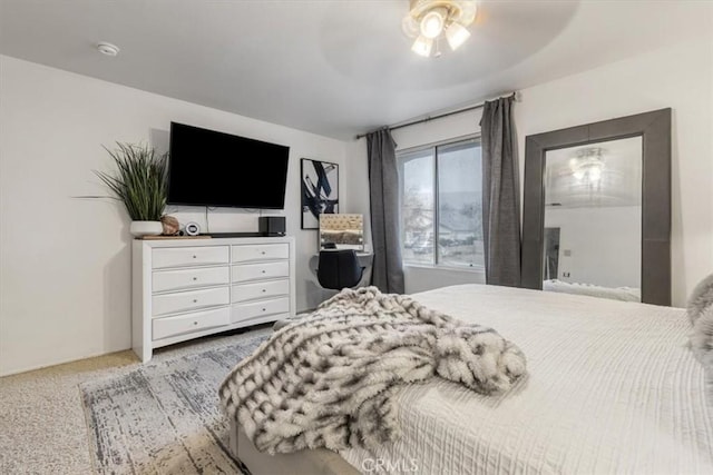 bedroom with ceiling fan and carpet flooring