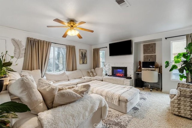 carpeted living room featuring ceiling fan