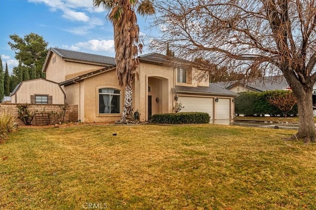 view of front of home featuring a garage and a front yard