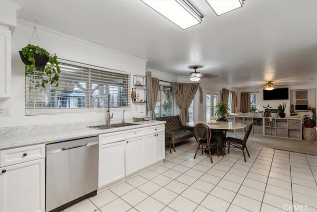 kitchen with sink, light tile patterned floors, dishwasher, ceiling fan, and white cabinets