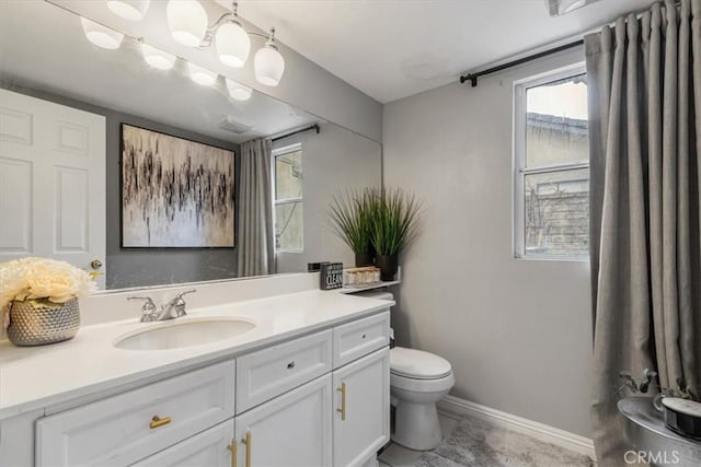 bathroom featuring vanity and toilet