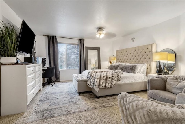 bedroom featuring light carpet and ceiling fan