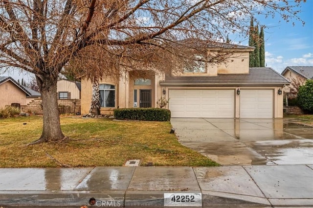 view of front of house featuring a garage and a front yard