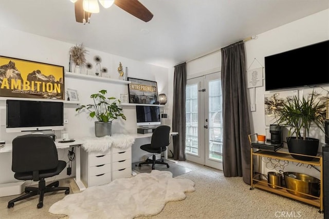 carpeted office space with ceiling fan and french doors