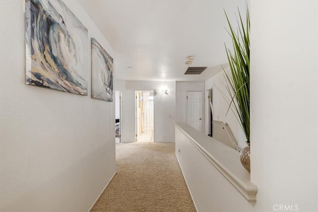 hallway featuring carpet flooring