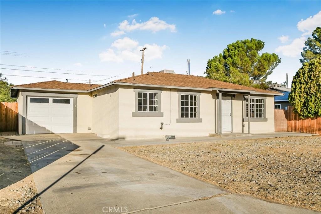 ranch-style home with a garage