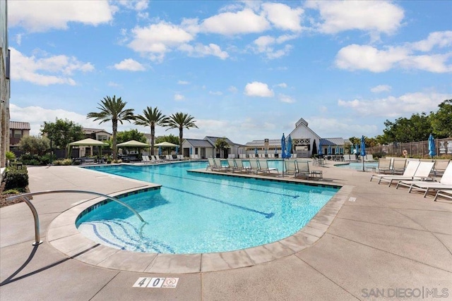 view of swimming pool featuring a patio area