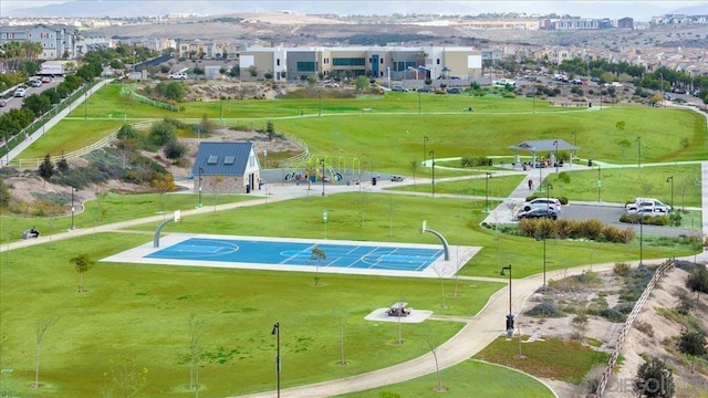 view of property's community with basketball court