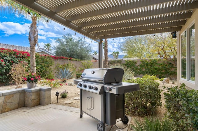 view of patio / terrace featuring a grill and a pergola