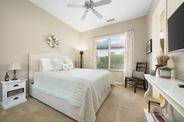 bedroom with light carpet and ceiling fan