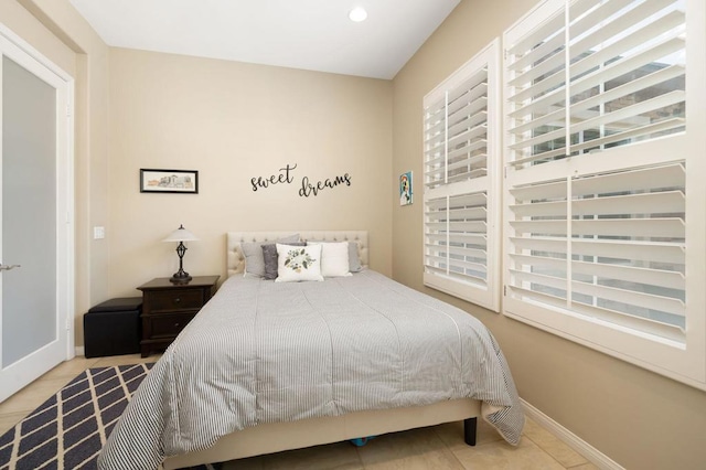 bedroom featuring light tile patterned flooring